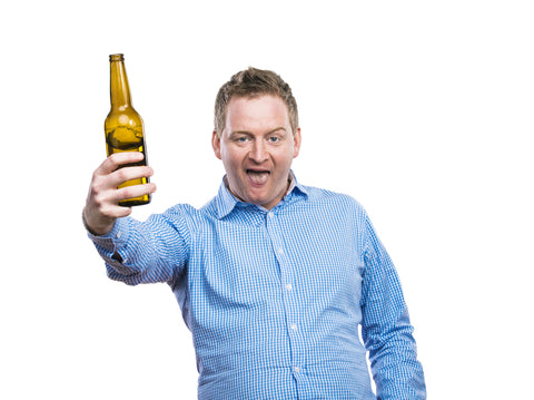 Drunk man holding beer bottle