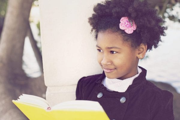Little black girl reading