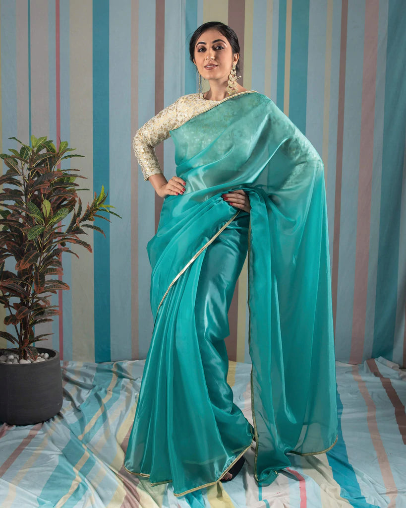 Turquoise Plain Liquid Organza Saree With Lace Border – Fabcurate