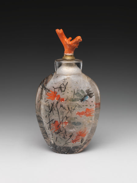 A Chinese snuff bottle (for holding tobacco) of crystal, with a coral stopper. (Metropolitan Museum of Art)