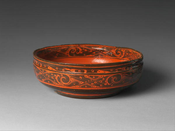 A bowl of black lacquer painted with red lacquer from the Western Han dynasty (206 B.C.–A.D. 9). (Metropolitan Museum of Art)