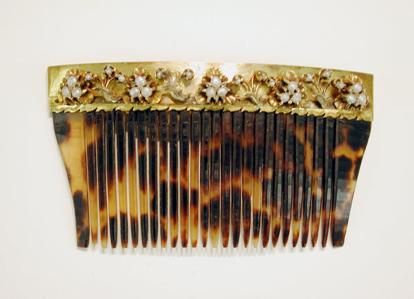 Tortoise shell hair comb with gold and pearl decoration. (Freer Sackler Gallery)