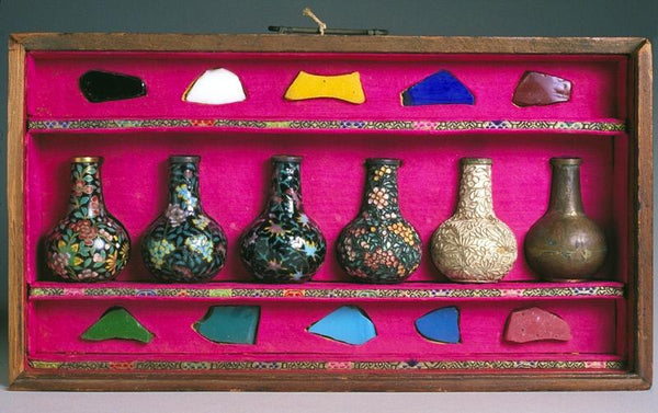 A set of small vases used to demonstrate the materials and process of making cloisonné. "Read" the vases from right to left. (Asian Art Museum)