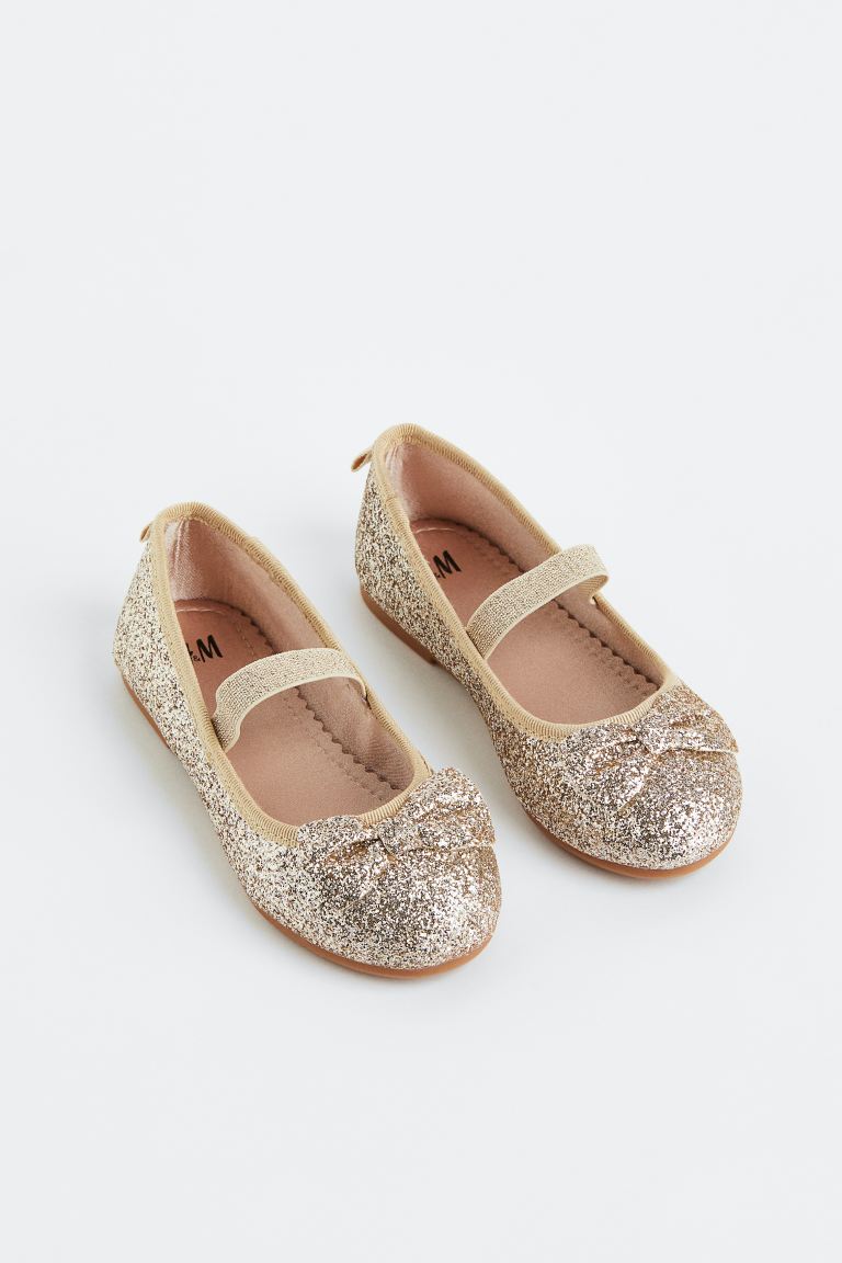 Zapatillas doradas chongo H&M niña – Kima