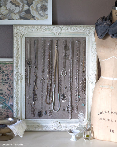 http://liagriffith.com/diy-antiqued-frame-jewelry-display/