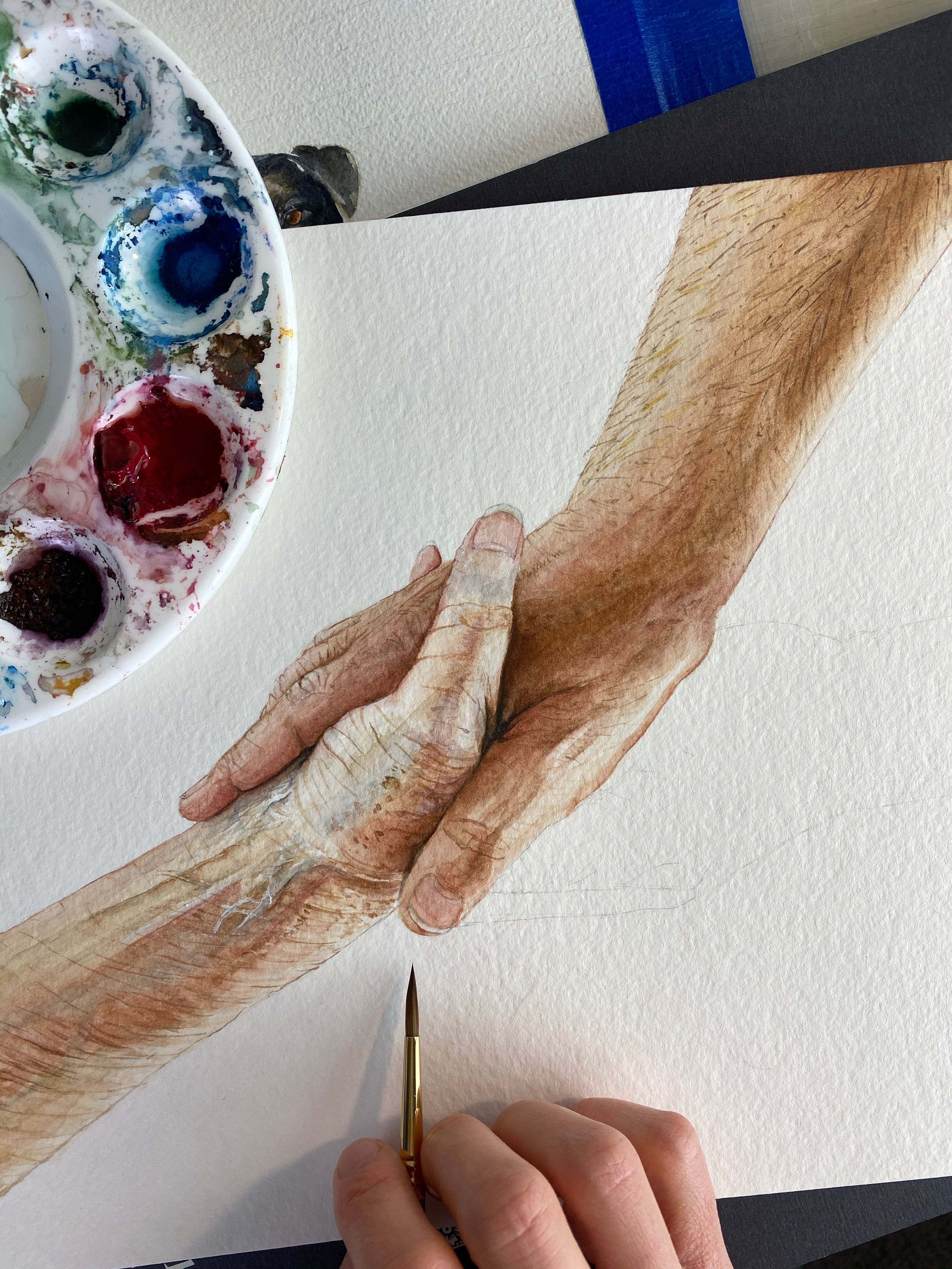 In process painting of helping hands.
