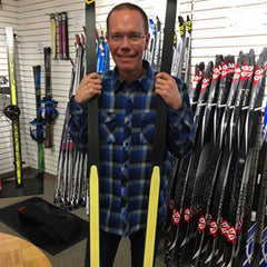 Kevin Robinson holding skin skis