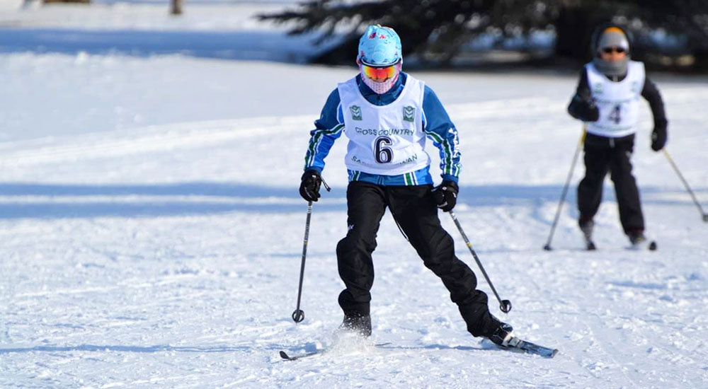 Child skiing with sunglasses 
