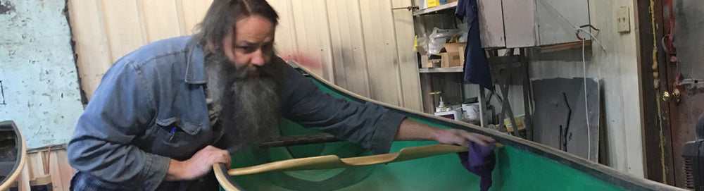 Martin Bernardin building a canoe