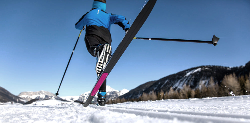 Skier using skin skis 