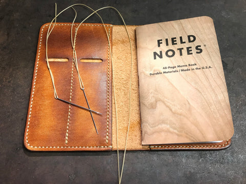 Leather field notes cover hand stitched waxed linen thread saddle stitch harness stitched
