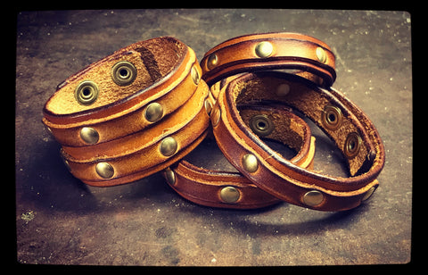 Brown leather and brass rivet bracelets