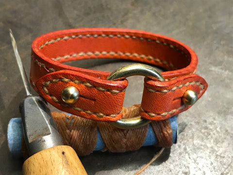 Orange leather and brass bracelet hand sewn 