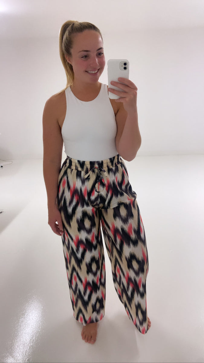 Black and pink printed trousers