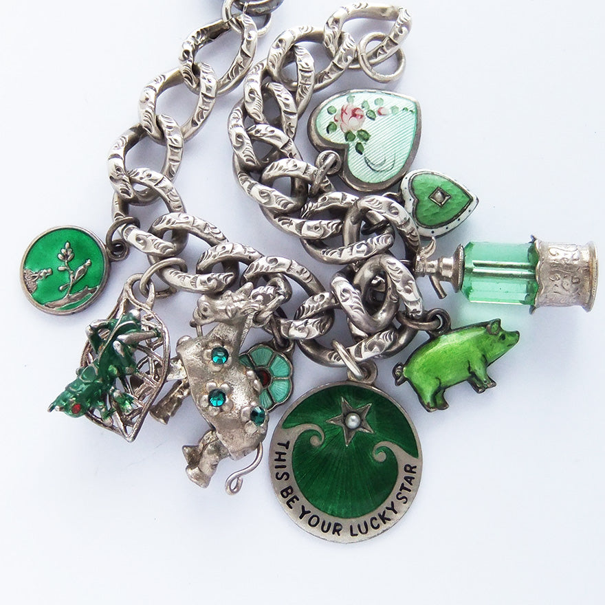 Charm bracelet with antique and vintage enamel and crystal green charms | Silver Star Charms