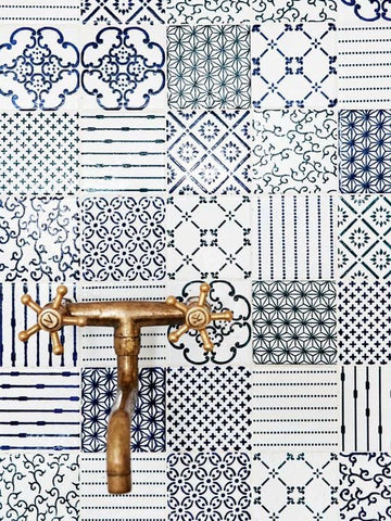 Close up on kitchen tiles and faucet