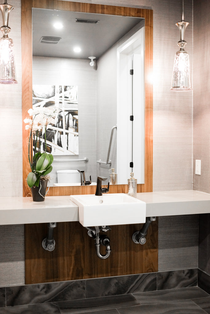 Urbandale sales centre bathroom focus on sink and mirror.