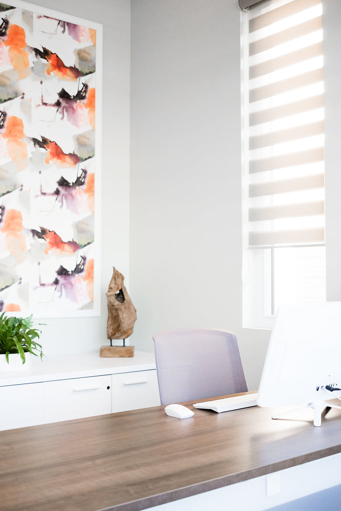 Urbandale Sales Centre desk, chair and office art.