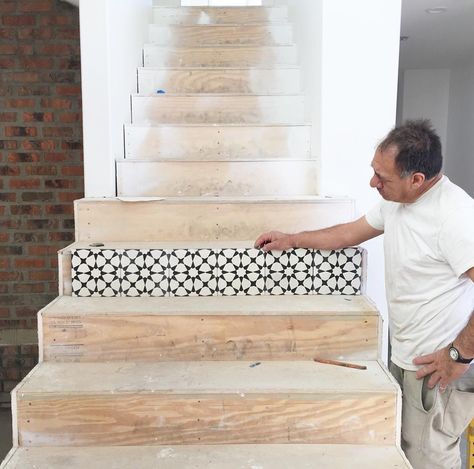 Tiles being installed on stairway