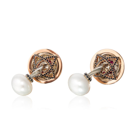 Cufflinks in 18k rose and white gold with 12–15 mm South Sea cultured pearls with 5.69 cts. t.w. black diamonds and rubies by Chris Faber of Stuller, Inc.