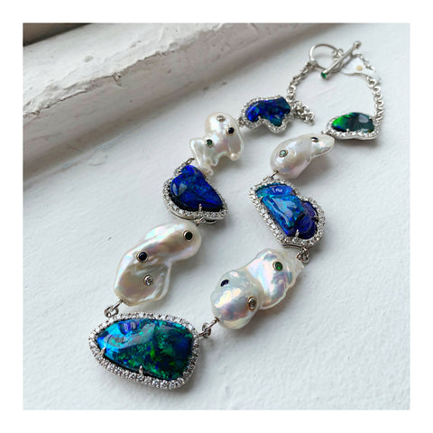 Necklace in platinum with 51.75 cts. t.w. black opals, cultured freshwater pearls, 4.12 cts. t.w. diamonds, 0.43 ct. t.w. tsavorite garnet, and 0.42 ct. t.w. sapphires by John Ford of Lightning Ridge Collection by John Ford