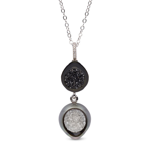 Day-to-Night pendant necklace by Hisano Shepherd of Little h Jewelry in Los Angeles. Made in 14k gold with sliced and carved Tahitian pearls and black and colorless diamonds.
