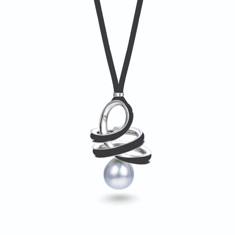 Orbit pendant by Timo Krapf of Timo Krapf Jewelry in Pittsford, N.Y. Made in platinum with a Tahitian pearl and cord and inspired by anticlastic raising. 