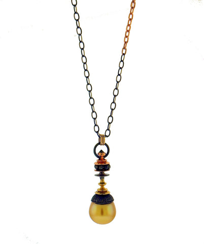 Golden pearl parasol necklace from William Travis Jewelers
