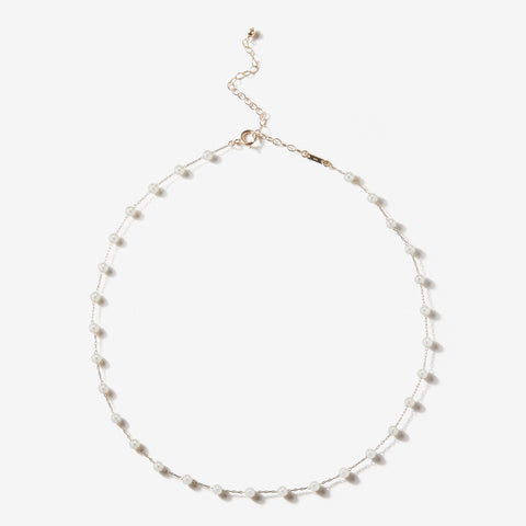 Station necklace in 14k gold with white freshwater pearls, $725; Mizuki