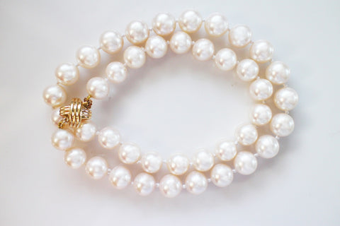 Necklace with 9 mm to 10 mm cream-color freshwater pearls and a 14k yellow gold XO-style clasp, $5,000; King's Ransom Pearls