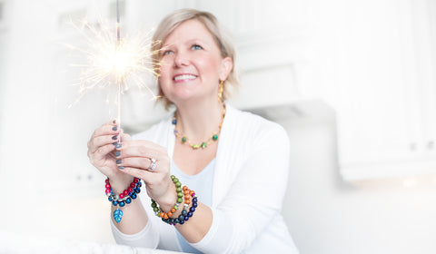 Kristen Edmiston, jewelry designer wearing bracelets and necklaces that she makes and sells.