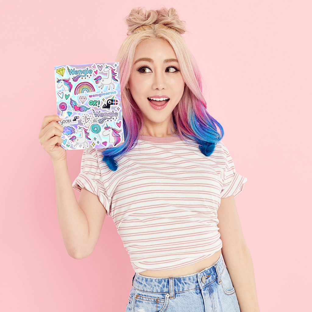 Take a look at Wengie's absolutely essential back to school supplies. This exclusive Wengie x Yoobi collaboration brings you a limited edition box filled with magical goodies. From a glitter journal, unicorn pen and pencil case to washi tape and a custom designed sticker sheet. 