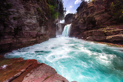 Waterfalls crashing at Saint Mary Falls in Glacier National Park