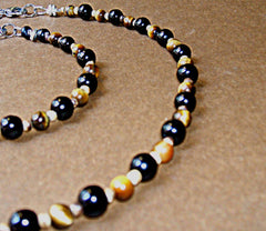 This is our Onyx and Tigers Eye Necklace