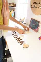 Kathy packaging a name bunting