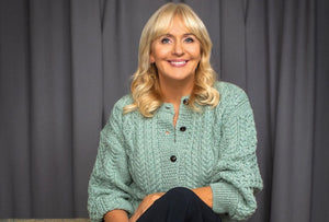 Miriam O'Callaghan wearing IrelandsEye Knitwear's  Clover Cardigan in Sage Marl