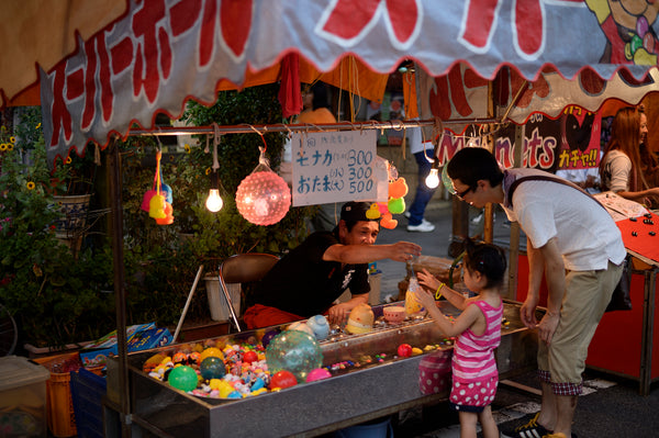 Tanabata vendor selling a toy at Tanabata Festival in Japan