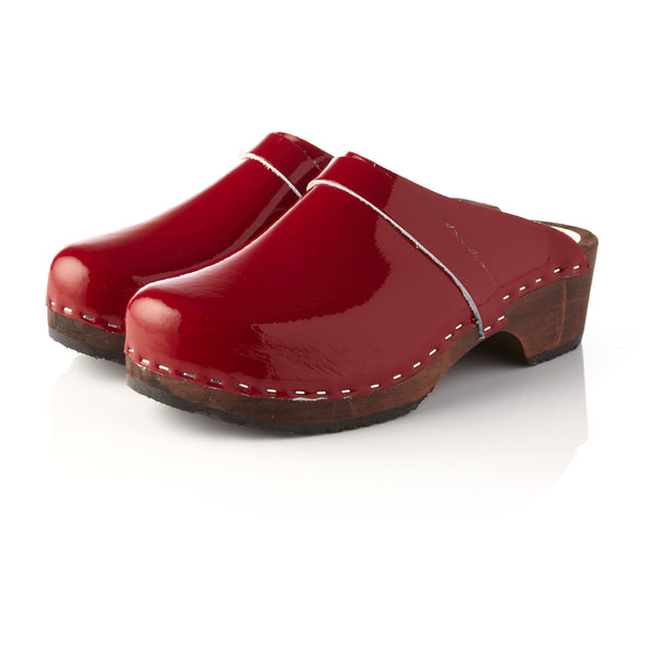 red patent clogs