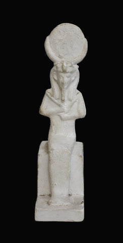 Photo of plaster cast sculpture of seated Egyptian idol with sun disk atop head