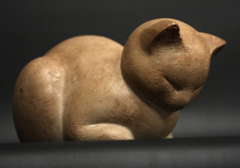 Photo of Original Caproni Cast of a Plaster Cat Sculpture with a grey/black background