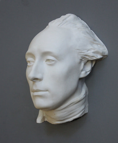 Photo of plaster Caproni cast of the mask of Lafayette on a grey background