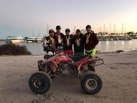 Team 109A posing for a picture after taking 2nd place at the 50th Baja 1000 in the Sportsman ATV Class