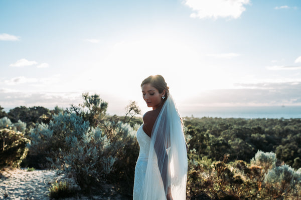 Sunset Bride with chantilly trim veil