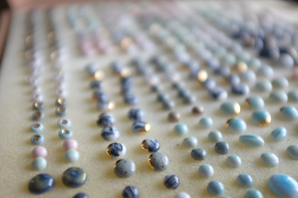 Porcelain and gold studs by Porcelain and Stone