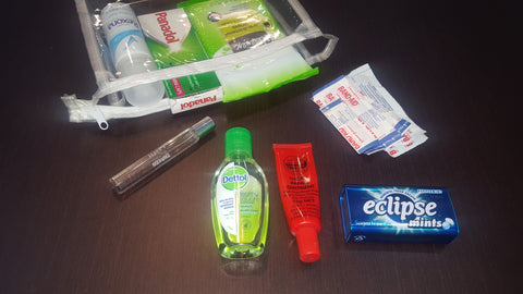 emergency bag, wipes, hand sanitizer, paw paw, mint , perfume ,deodorant 