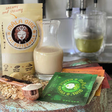 Load image into Gallery viewer, Ready to take your broth game to a whole new level? Say hello to our first ever māla girl oat buttermylk, no straining required! It is the perfect balance of creamy and dreamy with organic, gluten free oats, cacao butter for richness, essence of vanilla and a splash of Himalayan sea salt. How does it work? Simply add 1-2Tbsp. of oat buttermylk powder to 8 oz. of hot water and froth it up until its melted and creamy! Looking to add sweetness? Blend in date syrup, honey, maple or agave.
