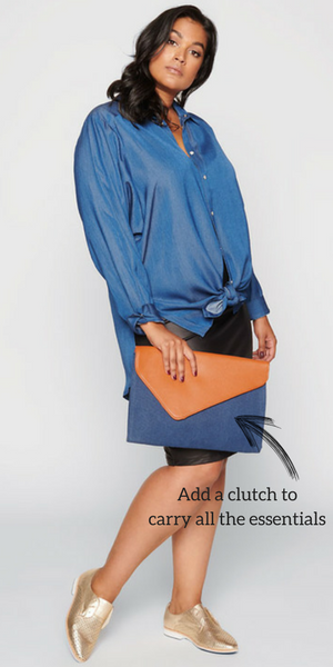 Add an oversized envelope clutch in the perfect combination of tan pleather and denim 