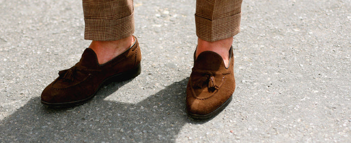 cuffed trousers and loafers with no socks