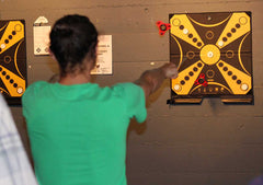 KOOBA player takes his aim at the board during the competition. 