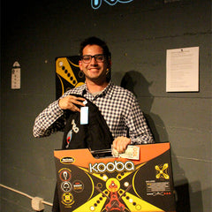 Third place KOOBA tournament finalist proudly holds up his t-shirt and KOOBA Game prize.